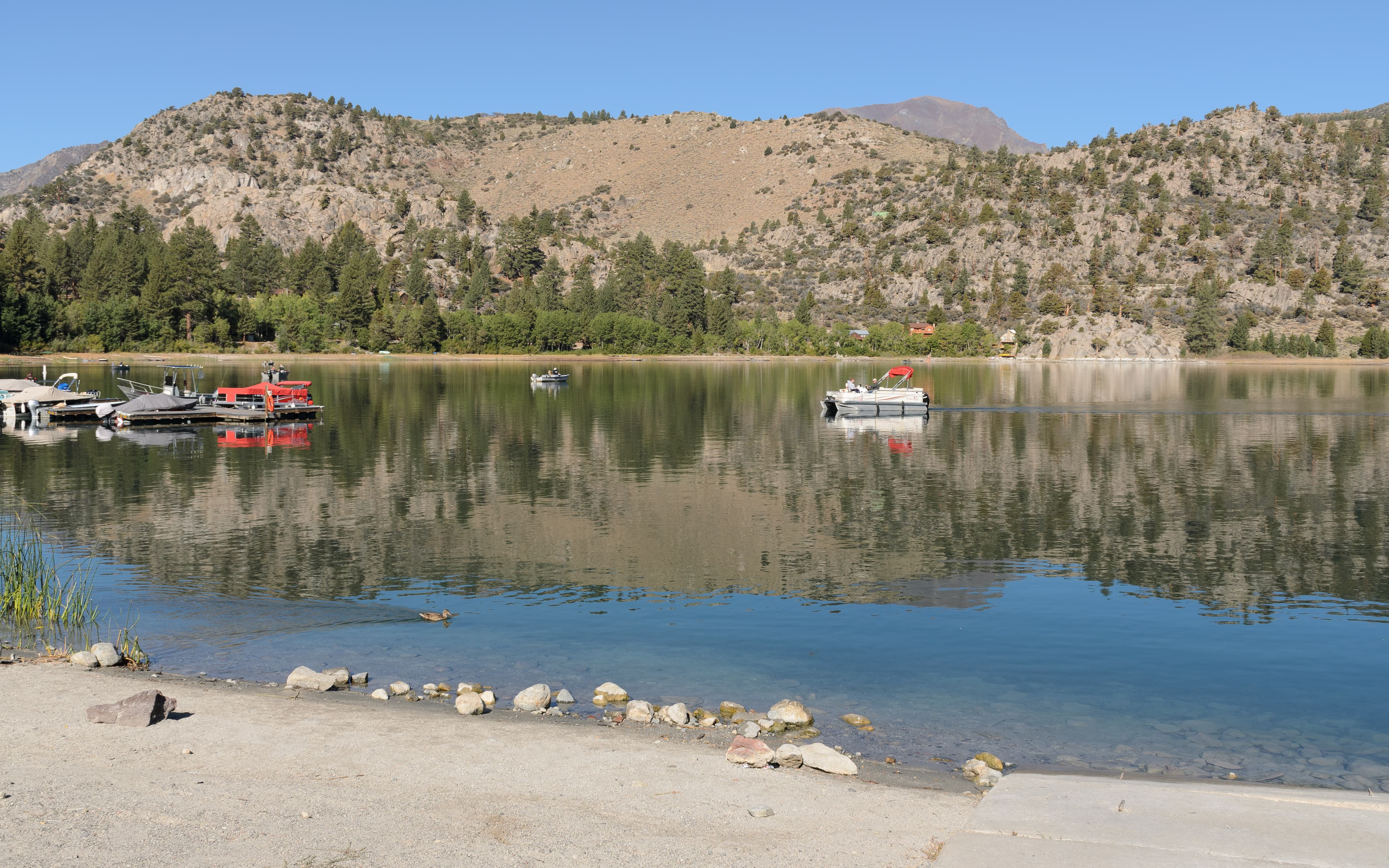 June Lake reflecting the mountain skyline on a clear September morning